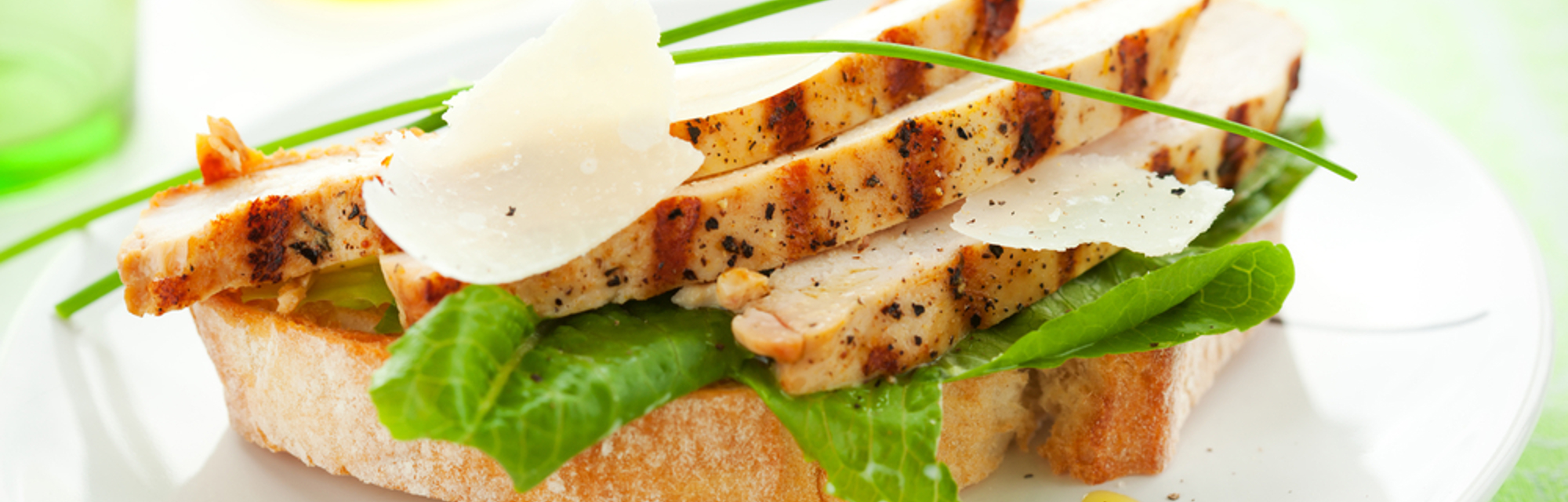 Open chicken caesar sandwich